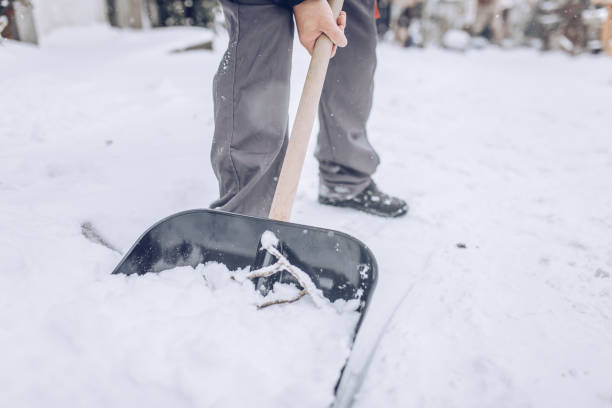 istock Man cleaning snow on the street 1170106162