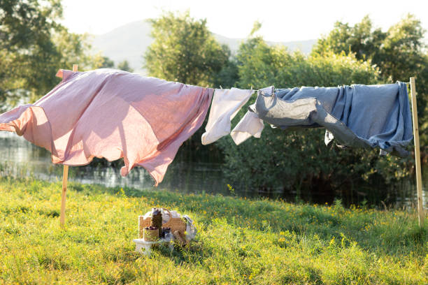 istock Clean bed sheet hanging on clothesline. 1170106229