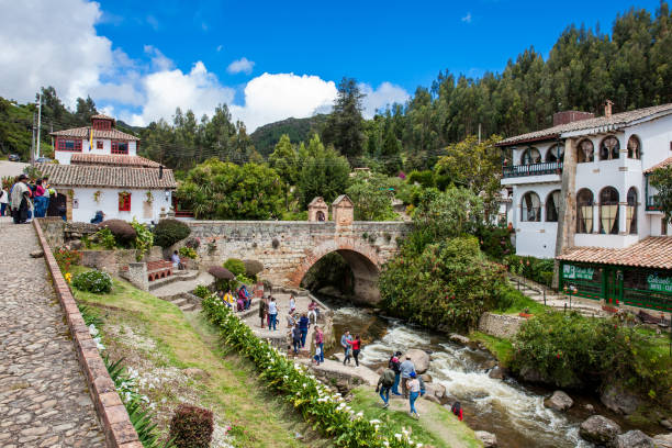 Tourists visiting the Royal Bridge of Calicanto at the beautiful small town of Mongui in Colombia Mongui, Colombia - August, 2019: Tourists visiting the Royal Bridge of Calicanto at the beautiful small town of Mongui in Colombia boyacá department photos stock pictures, royalty-free photos & images