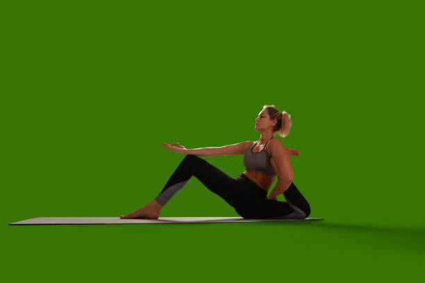 Yoga woman isolated on green screen.