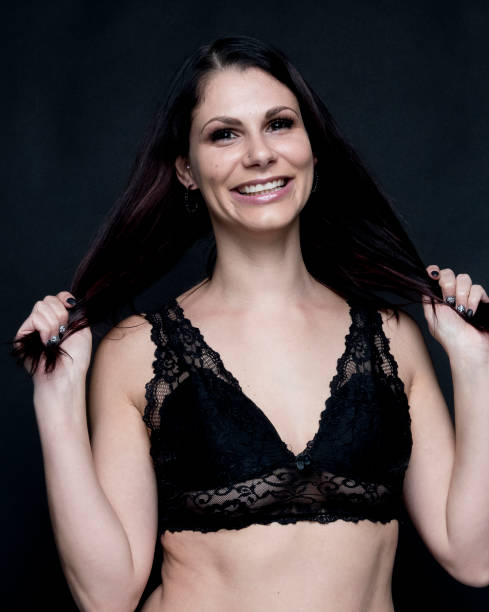 istock Beautiful female in front of black background 1170113094