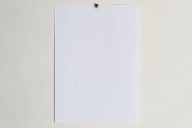 istock A sheet of white paper on a beige wall. 1170113200