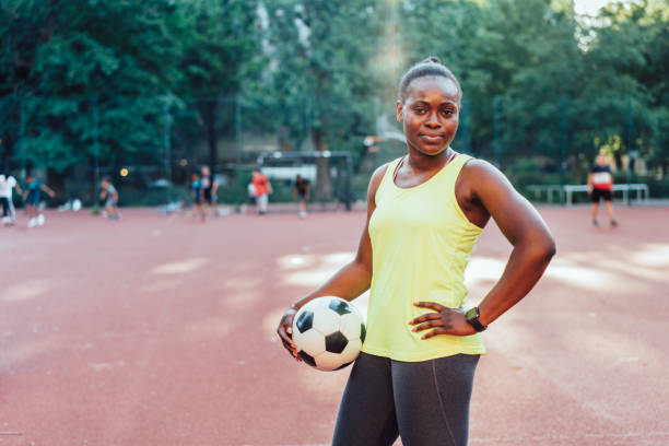 istock Confident woman football player 1170115450
