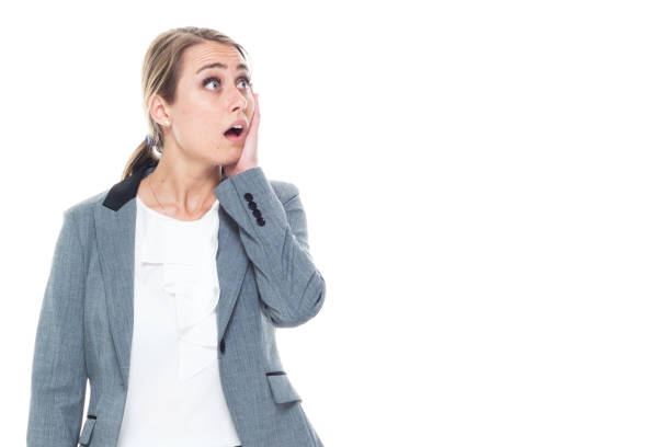 istock Smart attractive young businesswoman on white background - confusion 1170115546