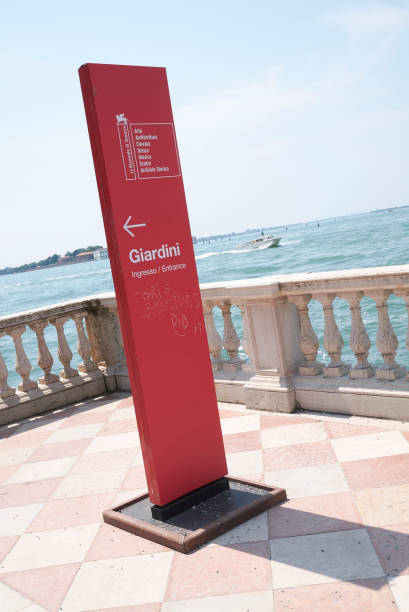 View of Venice Biennale Giardini entrance sign Venice, Italy - July 02, 2019 :  View of Venice Biennale Giardini entrance sign venice biennale stock pictures, royalty-free photos & images