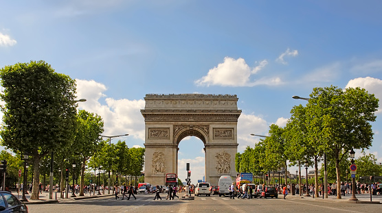 PARIS, FRANCE  - August 19, 2017.  Paris, France - famous Triumphal Arch located at the end of Champs-Elysees street. UNESCO World Heritage Site. PARIS, FRANCE  - August 19, 2017
