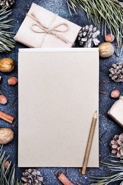 istock Christmas background with blank notebook surrounded by Christmas decorations. Letter to Santa or Christmas shopping list 1170124524