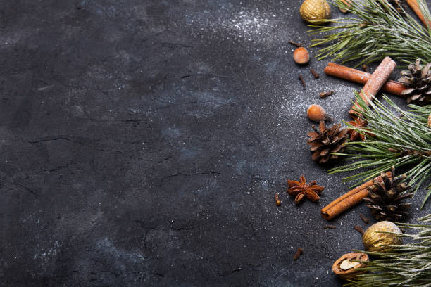 istock Beautiful Christmas Background with copy space for your text. Pine branch, cones, cinnamon, nuts covered with snow 1170125066