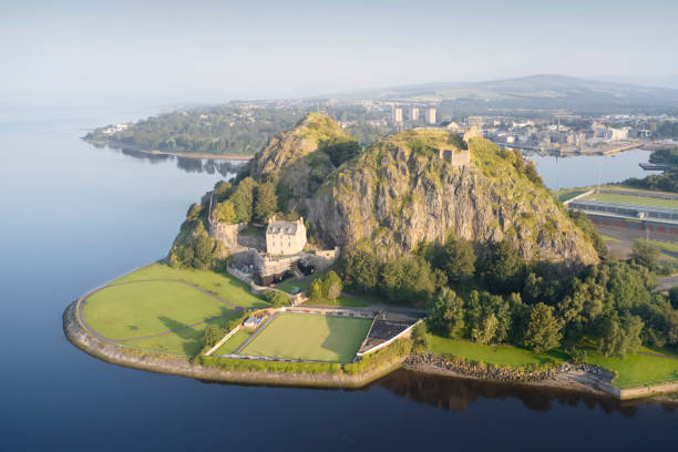 Dumbarton Castle on volcanic rock aerial view from above Dumbarton, Dunbartonshire / Scotland, UK - August 25th 2019: Dumbarton Castle on volcanic rock aerial view from above dumbarton castle stock pictures, royalty-free photos & images