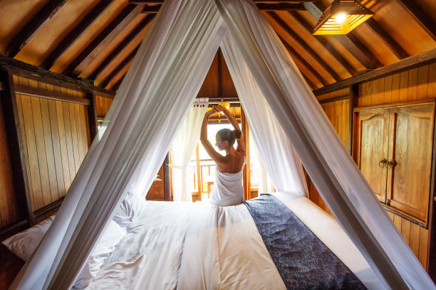 istock beautiful woman after shower on a bed 1170126230