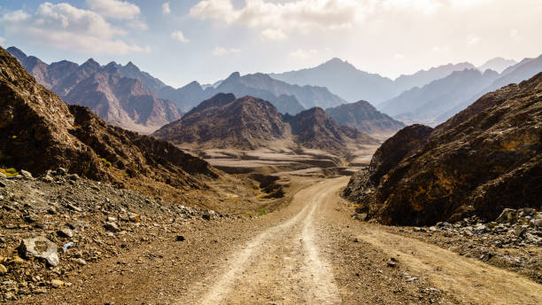 Dirt road in Hajar mountains in Dubai, UAE stock photo