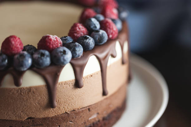 istock Fresh beautiful chocolate cake with fruit and berry 1170130236