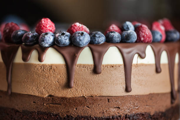 istock Fresh beautiful chocolate cake with fruit and berry 1170130279