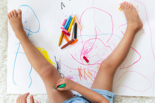 istock Little girl drawing 1170131771