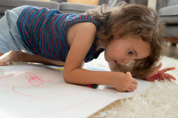 istock Little Girl drawing 1170132057