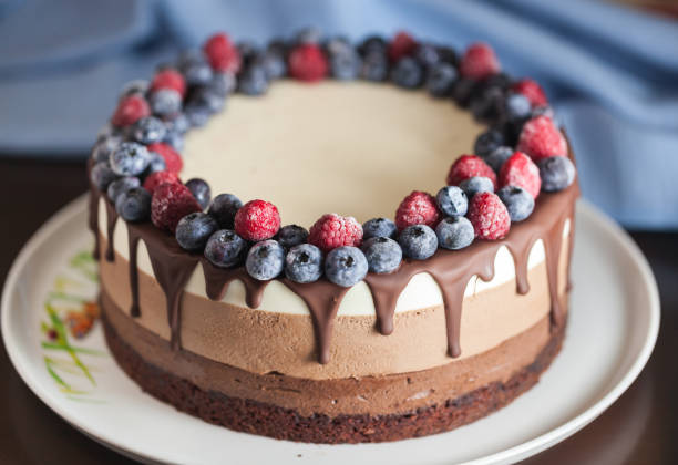 istock Fresh beautiful chocolate cake with fruit and berry 1170133412
