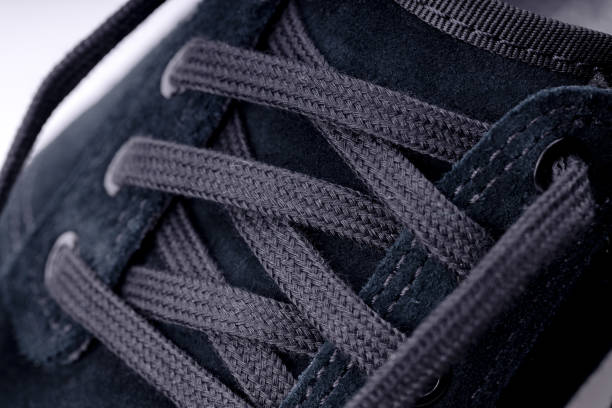 istock shoelace at modern sneaker shoe. close up. 1170133636