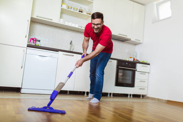 istock Young man washing floor on the kitchen 1170134769