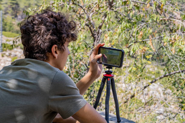 istock Young man photographing 1170135042