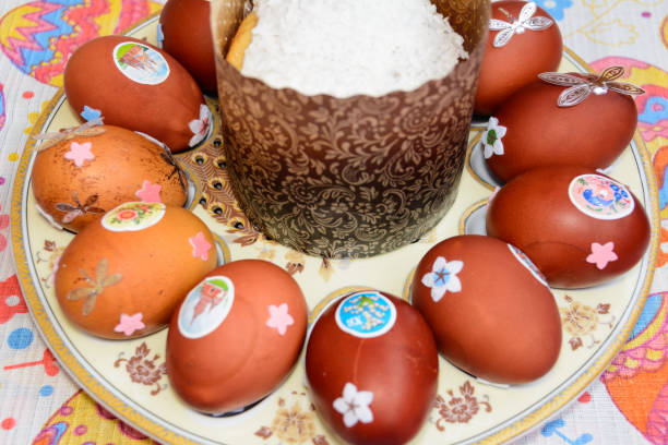 istock Easter cake and decorated chicken eggs laid out on a plate. Easter tradition: chicken eggs are exchanged and they say: 