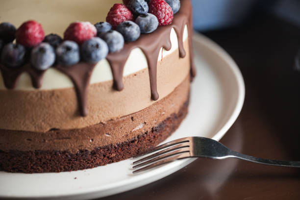 istock Fresh beautiful chocolate cake with fruit and berry 1170139804