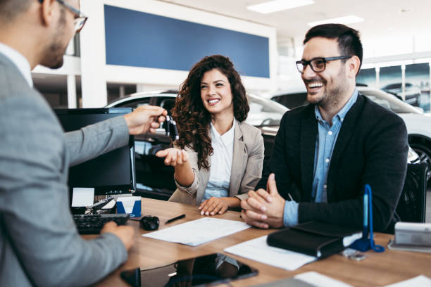 istock Attractive couple buying new car 1170139926