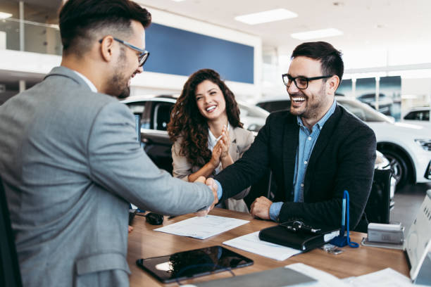 istock Attractive couple buying new car 1170139927