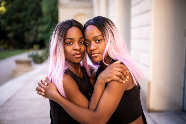 Portrait of a twin sisters looking at camera