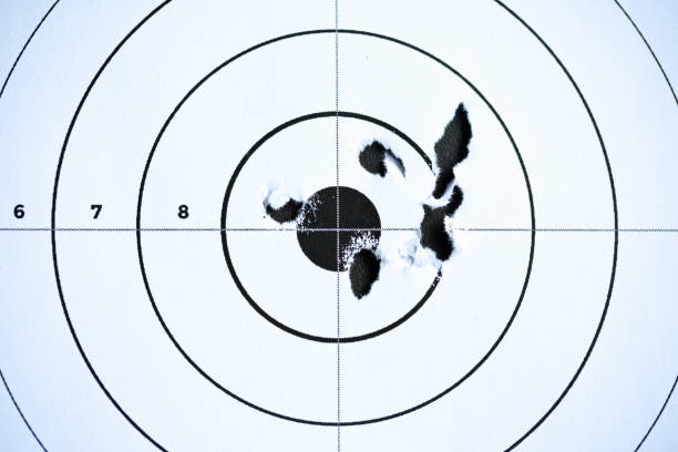 istock Shooting target with accurate close grouping of bullet holes 1170146041