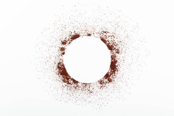 Ground coffee and beans on white background. Copy space for your text.