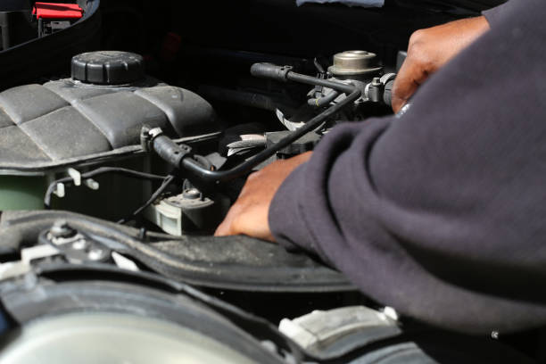 istock someone under the hood fixing a car 1170151855