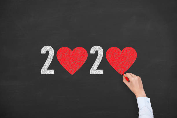 istock New Year 2020 with Heart Shape on Chalkboard Background 1170151996