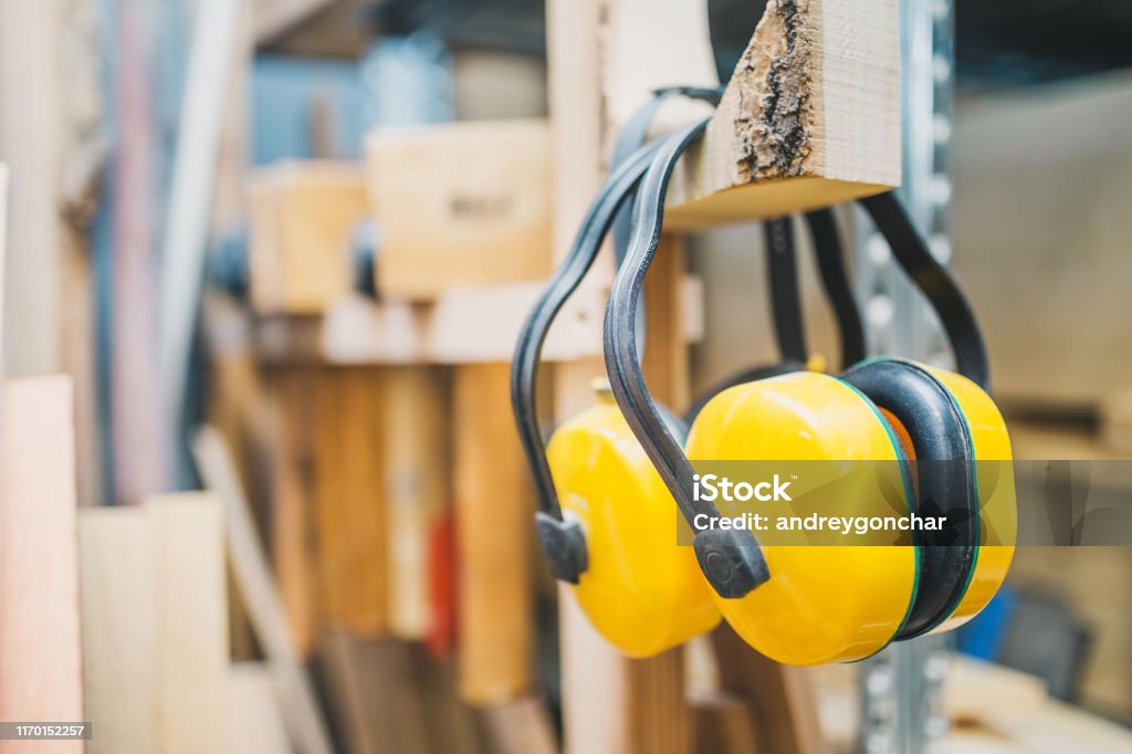 Carpentry workshop - noise protection headphones Carpentry workshop - noise protection headphones - safety technology Protection Stock Photo