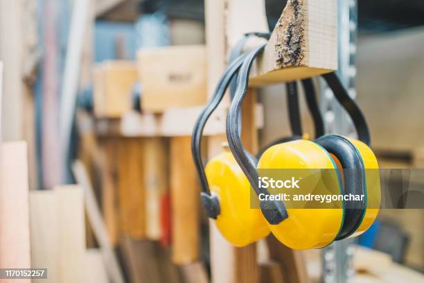 Carpentry Workshop Noise Protection Headphones Stock Photo - Download Image Now - Protection, Listening, Noise