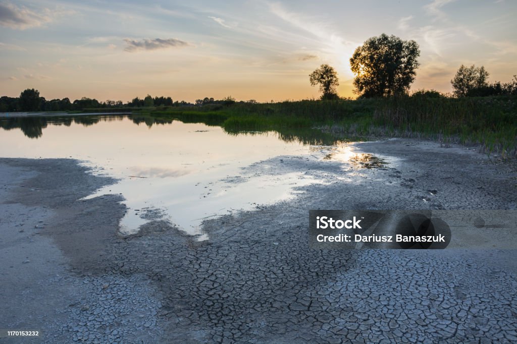 Drying water reservoir, summer in Poland Drying water reservoir. Summer 2019, Staw, Poland. Drought Stock Photo