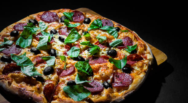 istock Pepperoni Pizza with Mozzarella cheese, salami, olive, pepper, Spices and Fresh basil. 1170153544
