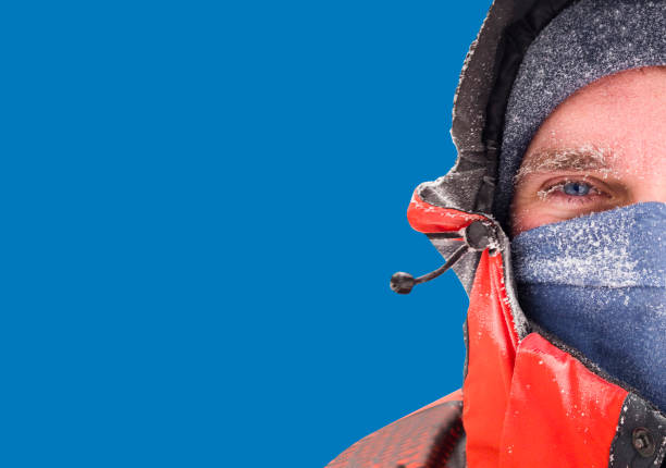 istock frozen man face in winter scene isolated on blue background 1170153559