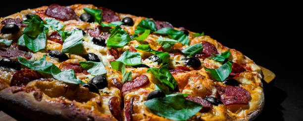 istock Pepperoni Pizza with Mozzarella cheese, salami, olive, pepper, Spices and Fresh basil. 1170153564