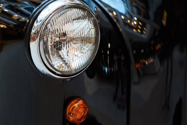 istock Close up headlight of a black vintage car 1170153580