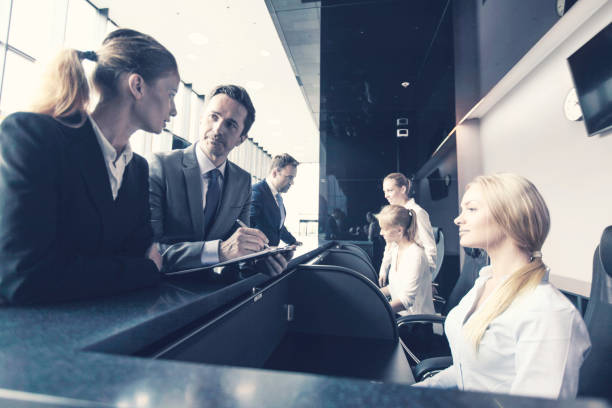 istock Business people at front desk 1170153871