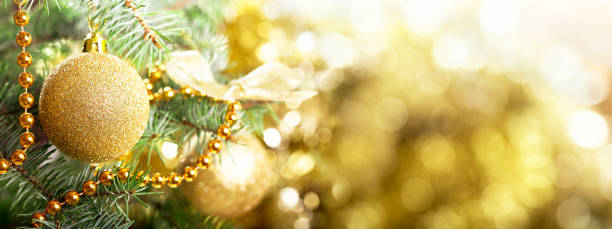 istock Christmas background. Christmas tree decorated with golden balls on blurred background 1170156052