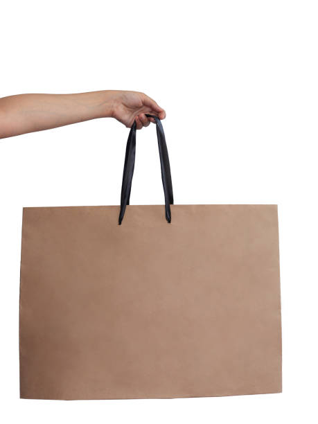 istock Hand holding shopping bag isolated on white 1170157515