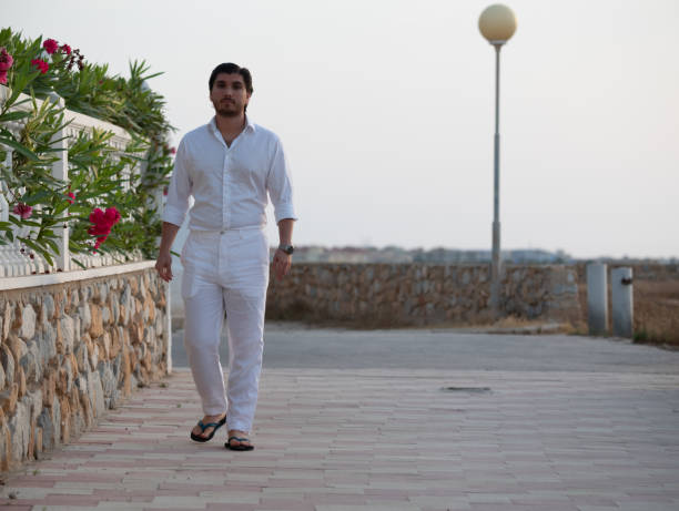 istock Man walking enjoying colorful sunset or sunrise 1170164872