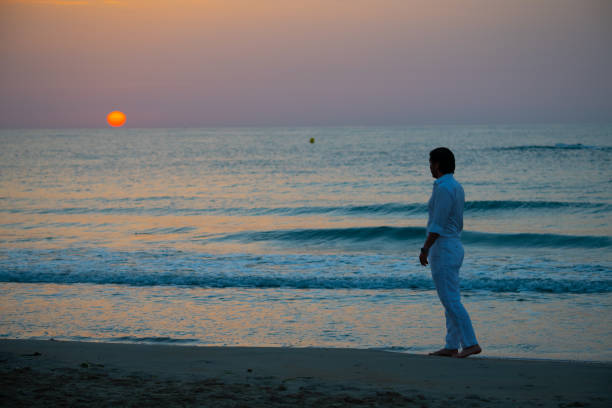 Man enjoying colorful sunset