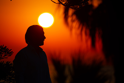 Man enjoying colorful sunset