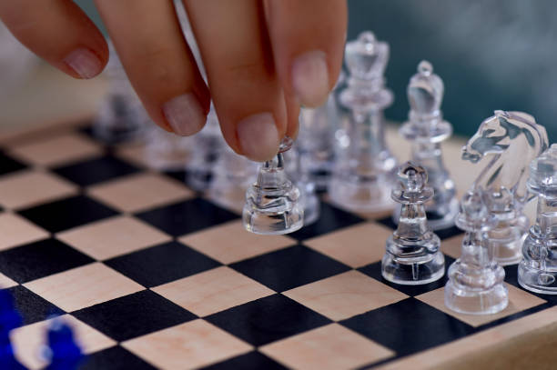 istock A woman's hand moves the pieces on the chessboard. Finding solutions, brain activity.The development of the mind 1170167776