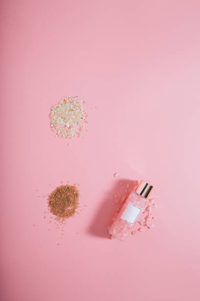 istock Creative flat lay top view bottle mock up on pastel millennial pink paper background copy space. Template for text lettering blogging 1170168618