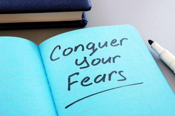 istock Conceptual hand writing text showing Conquer your fears 1170172999