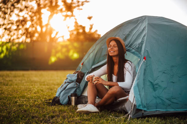 istock Beautiful woman relaxing on camping trip. 1170175819