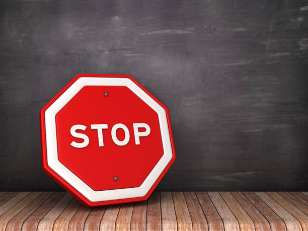 istock STOP Road Sign on Chalkboard Background - 3D Rendering 1170179217